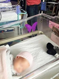 Why a Purple Butterfly Sticker Is Placed Near a Newborn